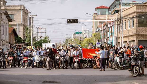 Protesters taking part in a demonstration against the military coup in Mandalay