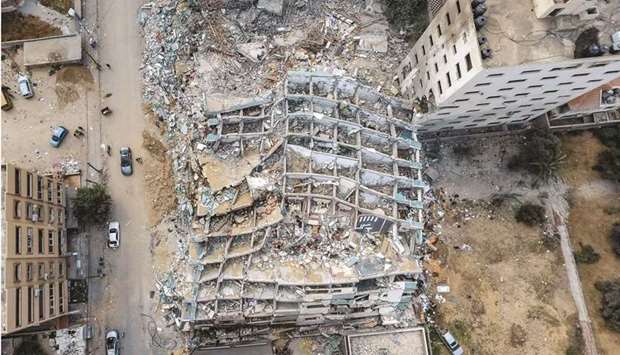 This aerial view taken yesterday, shows the Jala Tower in Gaza City, that was levelled by an air strike during the recent military conflict.