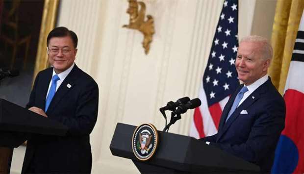 (file) US President Joe Biden (R) and South Korean President Moon Jae-in 