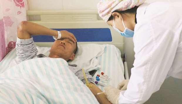A man receives treatment at a hospital in Jingtai county after extreme cold weather killed participants of an 100-km ultramarathon race in Baiyin, Gansu province, China, yesterday.