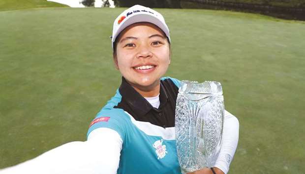 Hsu Wei-Ling of Chinese Taipei celebrates with the trophy after winning the Pure Silk Championship in Williamsburg, Virginia, United States, on Sunday. (AFP)