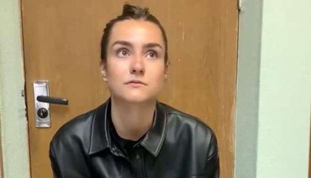 A view shows a woman, who names herself Sofia Sapega and admits that she is the editor of a Telegram channel ,Chernaya Kniga Belarusi, (Black Book of Belarus) which discloses the personal information of internal affairs officers, at an unknown location, in this still image taken from video released on May 25. Zheltye Slivy/Reuters TV via REUTERS