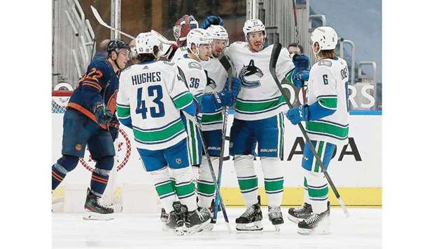 Vancouver Canucksu2019 Nils Hoglander (third from left) celebrates a first period goal against the Edmonton Oilers in Edmonton, Canada, on Thursday. (USA TODAY Sports)