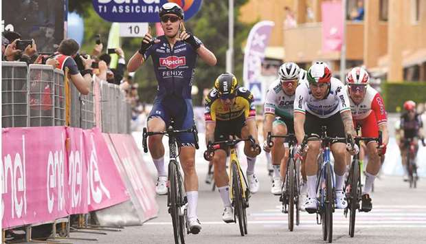 Alpecin-Fenix rider Tim Merlier of Belgium celebrates crossing the finish line to win the Giro du2019Italia second stage u2013 Stupinigi to Novara u2013 in Stupinigi, Italy, yesterday. (Reuters)