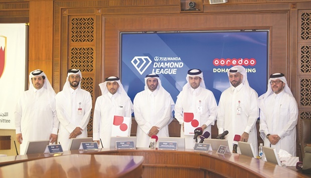 Qatar Athletic Federation President Mohamed al-Fadhala (centre) and Director of PR at Ooredoo Qatar Sabah Rabiah al-Kuwari pose with other officials after the press conference yesterday.