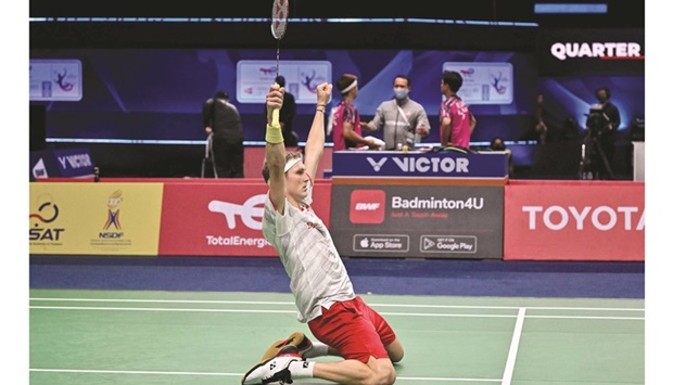 Denmarku2019s Viktor Axelsen celebrates beating South Koreau2019s Heo Kwang-hee in their quarter-final at the Thomas Cup in Bangkok yesterday. (AFP)