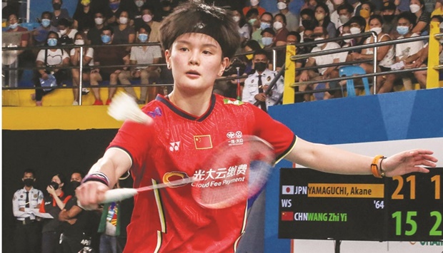 Chinau2019s Wang Zhiyi (also inset) hits a return against Japanu2019s Akane Yamaguchi during their womenu2019s singles final at the Badminton Asia Championships in Muntinlupa, Manila, yesterday. (AFP)