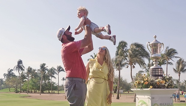 Jon Rahm celebrates his Mexico Open victory on Sunday with his wife Kelley and son Kepa.