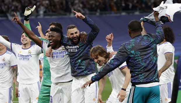 Real Madridu2019s Karim Benzema, Vinicius Junior, Luka Modric and teammates celebrate reaching the Champions League final after the match versus Manchester City.