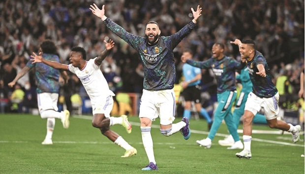 Real Madridu2019s Karim Benzema (centre) and his teammates celebrates after their win over Manchester City in Champions League second leg semi-final at the Santiago Bernabeu Stadium in Madrid on Wednesday night. (AFP)