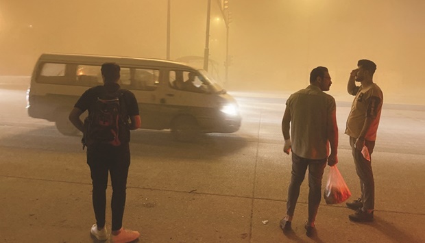 A view of the dust covered sky during a sandstorm, in Baghdad, yesterday.