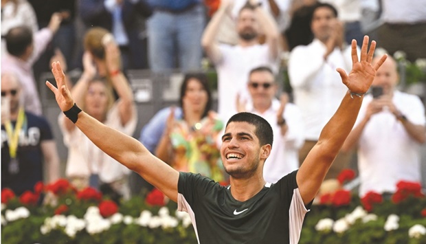 Spainu2019s Carlos Alcaraz celebrates after winning against Serbiau2019s Novak Djokovic during their 2022 ATP Tour Madrid Open singles semi-final at the Caja Magica in Madrid yesterday. (AFP)