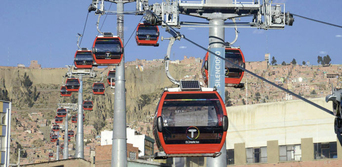 Cable cars ply over La Paz city during ahead of the inauguration of an urban ropeway between El Alto and La Paz on Friday.