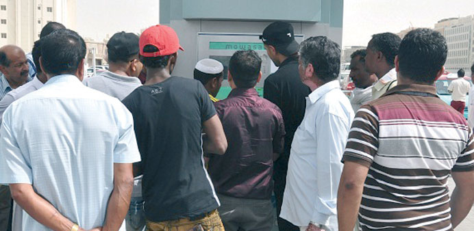 Bus passengers queuing in front of the newly-installed ticket vending machine at Mowasalatu2019s Central Bus Station.