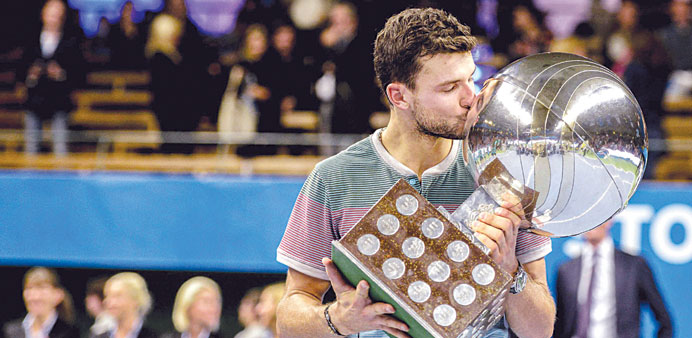  Bulgariau2019s Grigor Dimitrov kisses his trophy after winning the Stockholm Open tennis tournament. (Reuters)