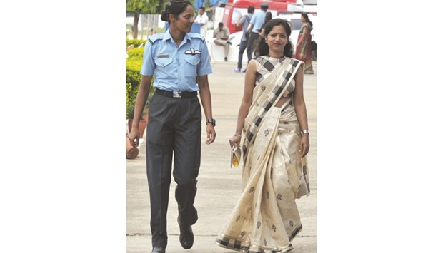 Indian Air Force fighter pilot Bhawana Kanth walks with her mother Radha Kanth after the combined graduation parade at the air force academy at Dundigal in Hyderabad yesterday.