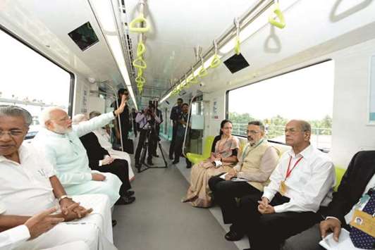 Prime Minister Narendra Modi takes a ride in the newly-inaugurated Kochi Metro yesterday. Also seen are Chief Minister Pinarayi Vijayan and Delhi Metro Rail Corporation Principal Adviser E Sreedharan who oversaw the project implementation.