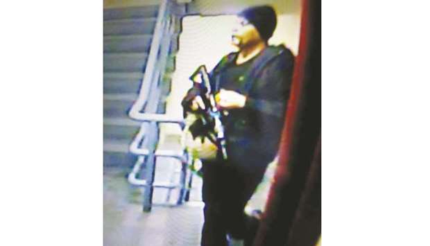 A suspected gunman is seen in the Resorts World Manila entertainment complex in Pasay City, Metro Manila.