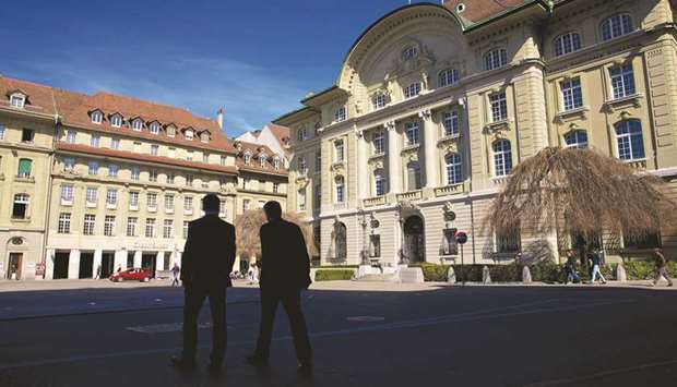 Pedestrians walk near the Swiss National Banku2019s (SNB) headquarters in Bern. Both the government and the SNB campaigned against sovereign money on the ground its risked crippling the economy and complicating monetary policy.
