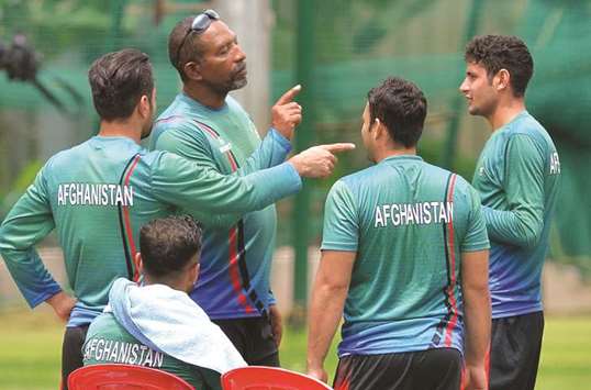 Afghanistan coach Phil Simmons (second right) with his players during a practice session at the M. Chinnaswamy Stadium in Bangalore yesterday. (AFP)