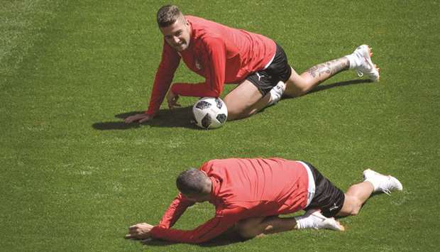 Serbiau2019s Sergej Milinkovic-Savic (top) and teammate Aleksandar Kolarov take part in a training session on the eve of their 2018 FIFA World Cup match against  Costa Rica in Samara yesterday. (AFP)