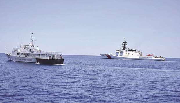 US Coast Guard Cutter Bertholf (right) and Philippine counterpart BRP Batangas conducted joint search and rescue and capability-building exercises off South China Sea, west of the Philippines, in May.