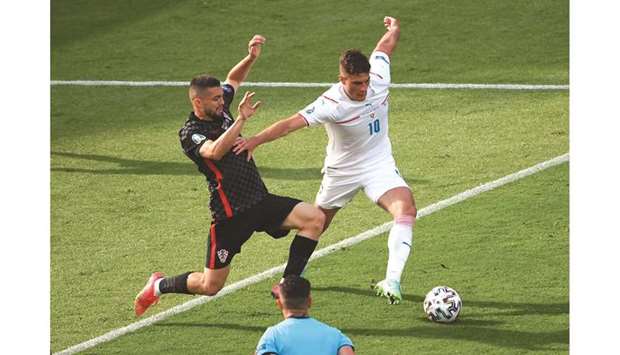 Croatiau2019s Mateo Kovacic (left) and Czech Republicu2019s Patrik Schick vie for the ball during the Euro 2020 Group D match at the Hampden Park in Glasgow, Scotland, yesterday. (Reuters)