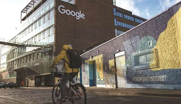 A cyclist passes the European headquarters building of Google Inc in Dublin. The European Commission said yesterday its new confrontation with the Alphabet Inc unit will focus on concerns the company may be illegally favouring its own online display advertising technologies, squeezing out rivals.