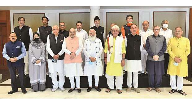 Indiau2019s Prime Minister Narendra Modi (bottom centre) poses for a picture with various political leaders from Jammu and Kashmir, in New Delhi yesterday.