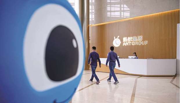 A logo of Ant Group is pictured at the headquarters of the company, an affiliate of Alibaba, in Hangzhou, Zhejiang province (file). China is allowing Jack Mau2019s Ant Group to start operations at its consumer finance company, the first sign of progress after a regulatory crackdown torpedoed the fintech giantu2019s record listing.