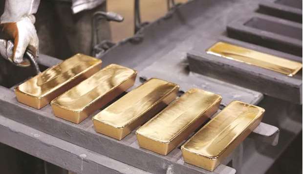 Freshly cast gold ingot bars sit in the foundry at the JSC Krastsvetmet non-ferrous metals plant in Krasnoyarsk, Russia. Gold will surge to fresh highs in the next year, but investors seeking currency alternatives as global debt balloons should look to bitcoin, according to a $7.5bn hedge fund.