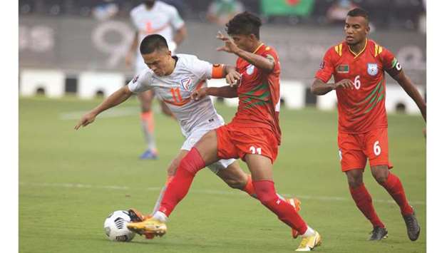 Indiau2019s Sunil Chhetri (left) vies for the ball with Bangladeshu2019s Rakib Hossain (centre) and Jamal Bhuyan during their Asian Qualifiers for the FIFA World Cup Qatar 2022 and AFC Asian Cup China 2023 Group E match on Monday. PICTURE: Jayan Orma