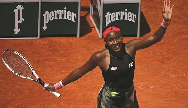 Coco Gauff of the US celebrates after winning against Tunisiau2019s Ons Jabeur (below) during their French Open fourth round match at Roland Garros in Paris yesterday. (AFP)