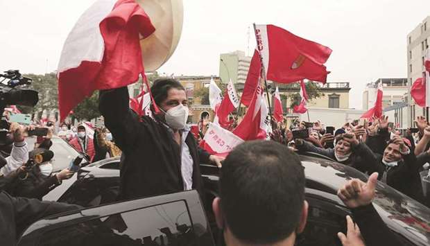 Castillo acknowledges his supporters during a rally one day after the run-off election, in Lima.