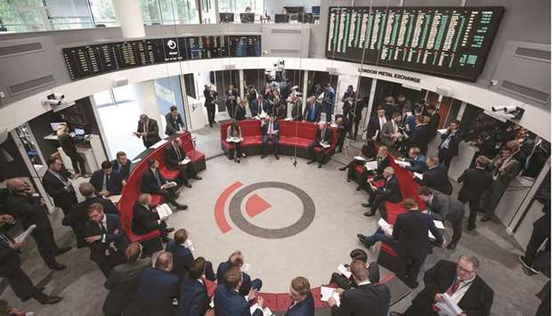 Traders on the floor of the open-outcry pit at the London Metal Exchange (file). The LME has cancelled a plan to close its open-outcry trading floor after a backlash from major users, and will reopen u201cthe Ringu201d in September.