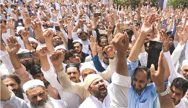 People raise their hands and chant slogans against the blasphemous comments by members of the Indiau2019s Bharatiya Janata Party, during a protest in Peshawar, Pakistan, yesterday.