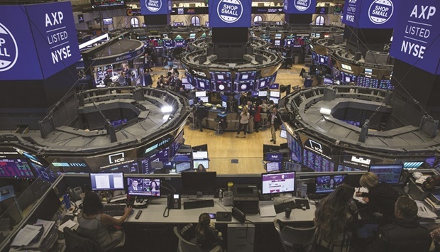 Traders work on the floor of the New York Stock Exchange. The bear market in US stocks could be a prelude to even tougher times to come: A market swoon has often come hand-in-hand with recession.