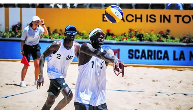 Qataru2019s Cherif Younousse (right) and Ahmed Tijan in action during their match against Americans Taylor Crabb and Taylor Sander at the Beach Volleyball World Championships in Rome.