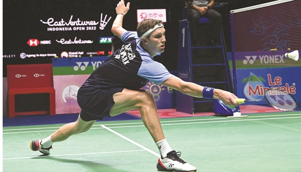 Denmarku2019s Viktor Axelsen hits a return against Malaysiau2019s Lee Zii Jia during their semi-final match at the Indonesia Open in Jakarta yesterday. (AFP)