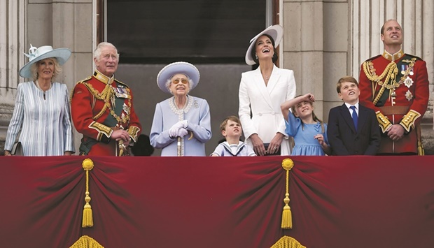 The Queen, along with members of the royal family, watches the special flypast by Britainu2019s RAF from Buckingham Palace balcony following the Trooping the Colour parade, as a part of her platinum jubilee celebrations, in London, Britain, on Thursday..