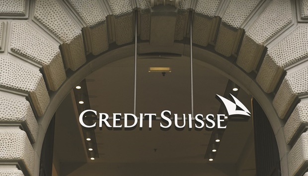 A sign above the entrance to the Credit Suisse Group headquarters in Zurich. Credit Suisse is looking to sell a $3.35bn loan to finance the buyout of auto dealership software company CDK Global. Itu2019s one of the biggest sales of the debt this year, and it comes after loan prices have edged higher in recent days.