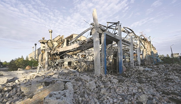 A destroyed depot of the Darnytsia freight cars repair plant, which was targeted by Russian missile strikes in Kyiv on Sunday. (AFP)