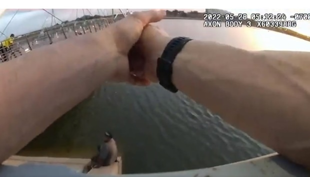 Sean Bickings just before wading into the lake as the police officers watch, as seen in the bodycam video