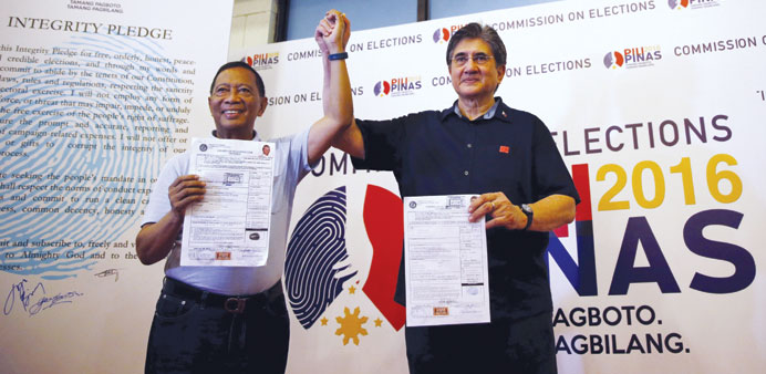 Vice President Jejomar Binay and his running mate Senator Gregorio Honasan display their Certificates of Candidacy (COC) for president and vice presid