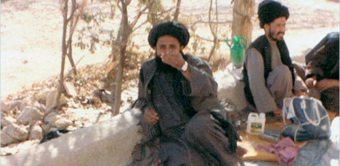 A file photo of Mullah Baradar, left.