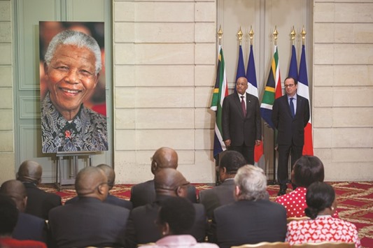 French President Francois Hollande, right, and South African President Jacob Zuma listening to an audio recording of former South African president Nelson Mandela before a joint press conference at the Elysee Palace in Paris yesterday.