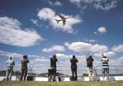 The Airbus A380 aircraft performs a manoeuvre during its display at the Farnborough International Airshow. The production of the double-decker will be slashed by more than half to one plane a month by 2018, the firm revealed on Tuesday.