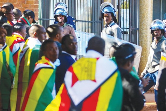 Zimbabwe anti-riot police guarding the entrance at the Harare magistrateu2019s court where pastor Evan Mawarire was due to appear in court on charges of inciting public violence following his arrest on Tuesday.