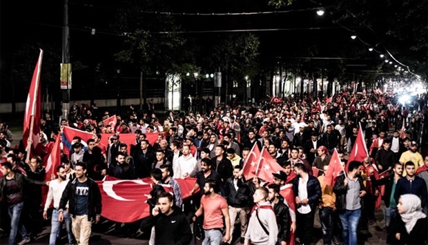 Erdogan-supporters demonstrate in Vienna, Austria,  as a military coup attempt against President Recep Tayyip Erdogan was under way on July 16, 2016.  Austria says it would ask Turkish ambassador whether Turkish officials encouraged this demonstration.