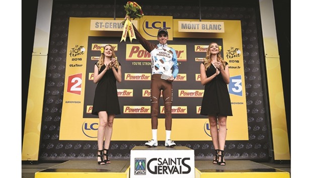 Franceu2019s Romain Bardet celebrates on the podium after winning the Tour de France 19th stage yesterday. (AFP)